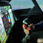 person controlling flight simulator
