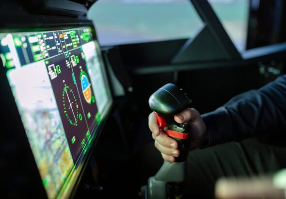 person controlling flight simulator